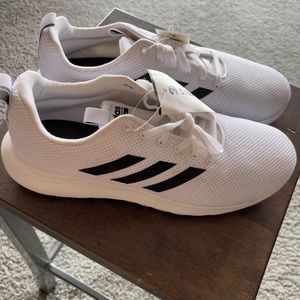 White and black adidas men’s athletic shoes